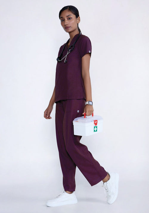 Front view of women’s wine V-neck scrub top